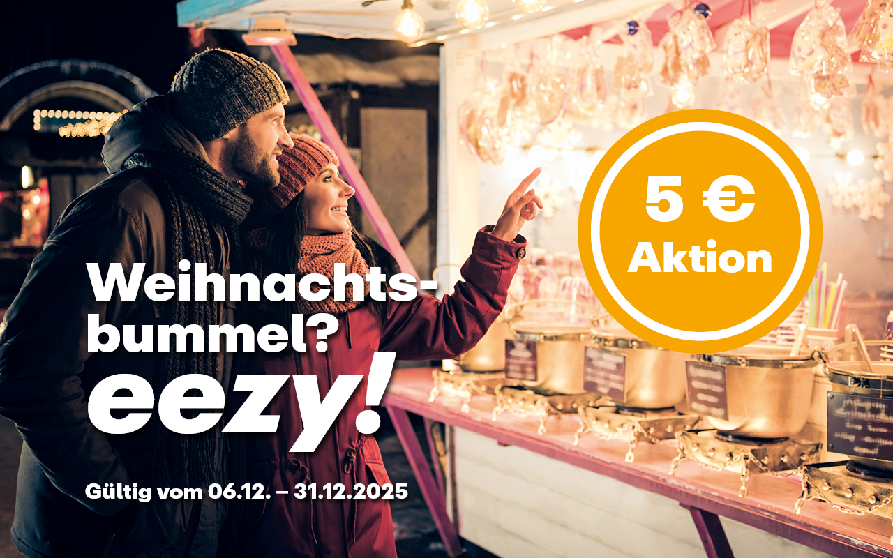 Ein Paar auf dem Weihnachtsmarkt. Darauf der Hinweis zur 5 €-Aktion und der Text "Weihnachtsbummel? eezy!"